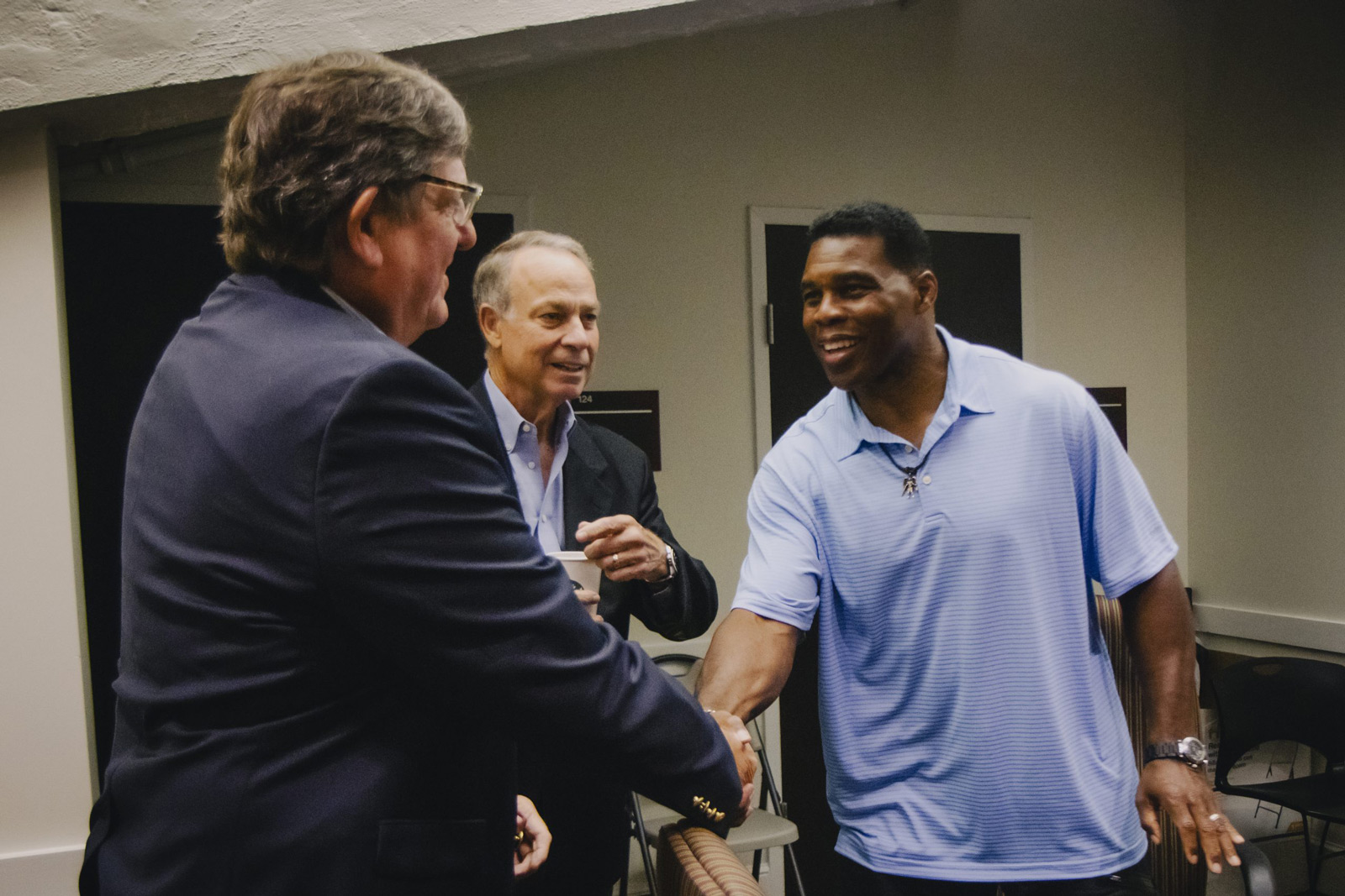 Herschel Walker shaking hands